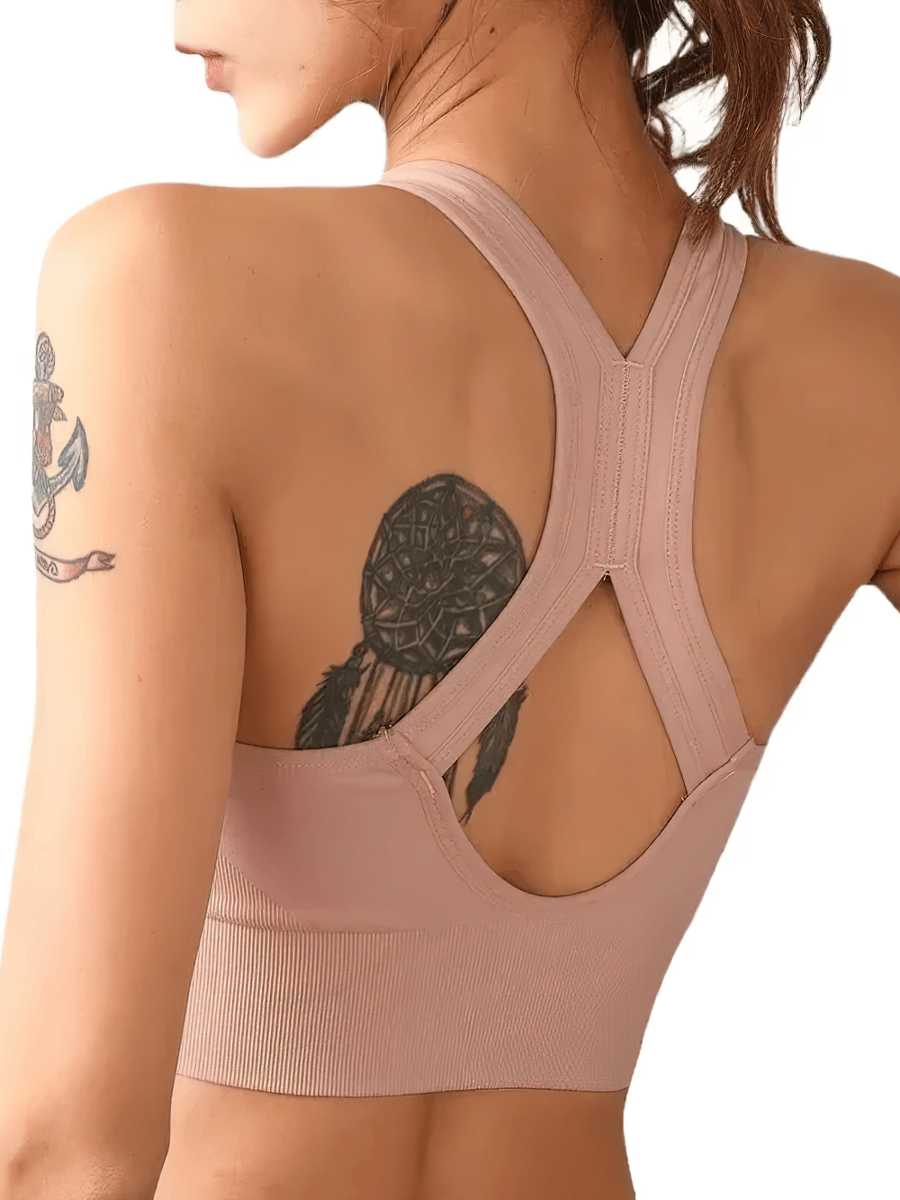 Back view of woman wearing Front Zip Crossback Sports Bra with Push Up Pads - SF4004 showing crossback design and tattoo.