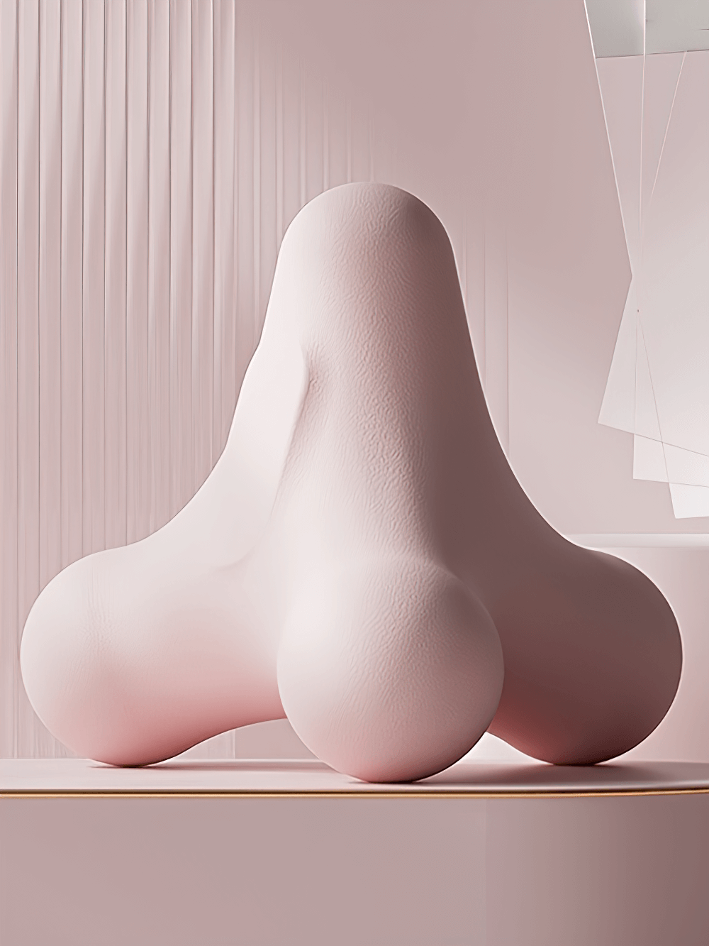 Sculptural pink abstract shape with smooth texture in a minimalist setting.