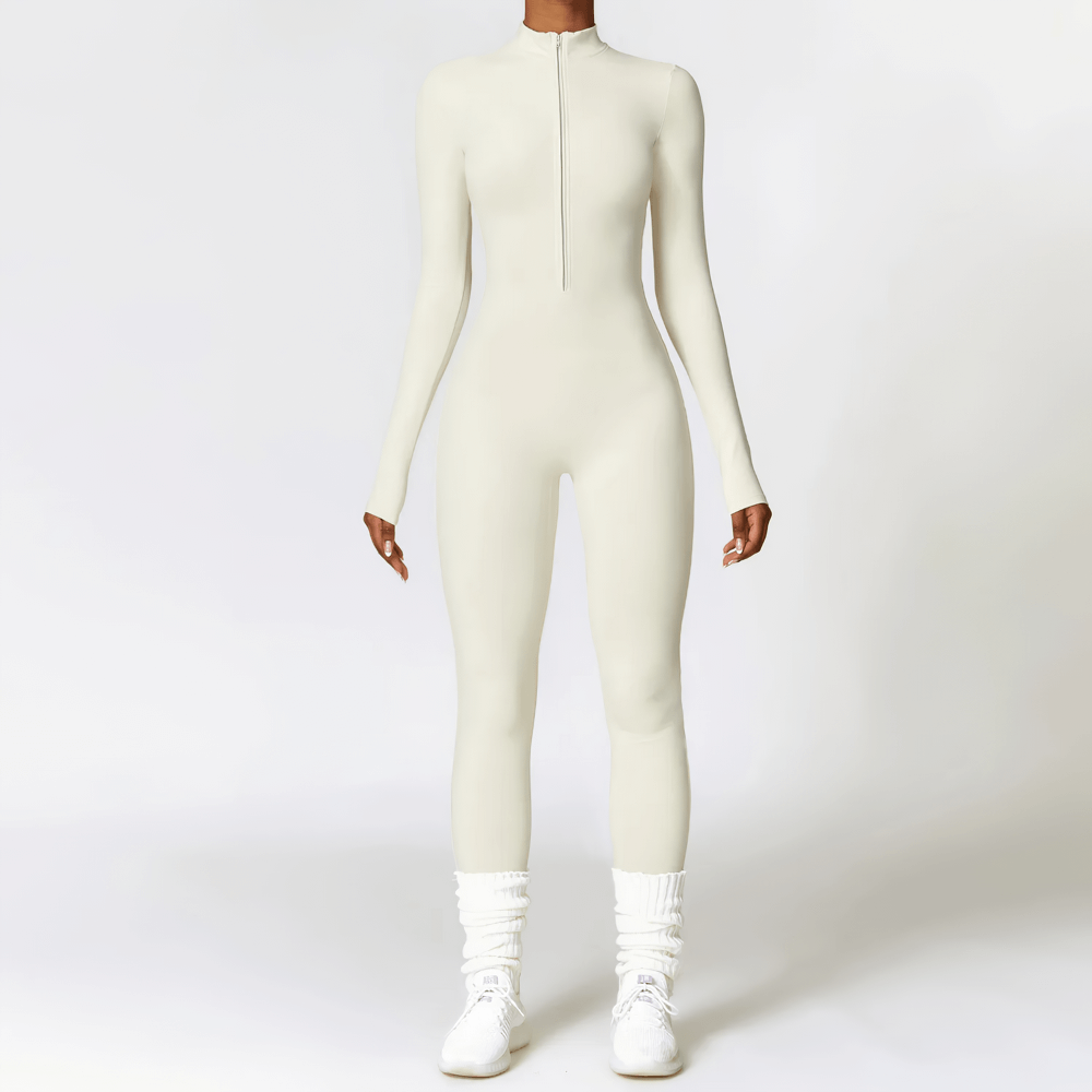 Full-length women's one-piece athletic jumpsuit in cream, ideal for yoga, running, or fitness with breathable, quick-dry fabric.