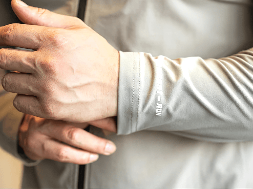 Close-up of hands wearing Full Zip Training Jacket with Chest Pocket - SF4607, showcasing the athletic fabric and sleeve design.
