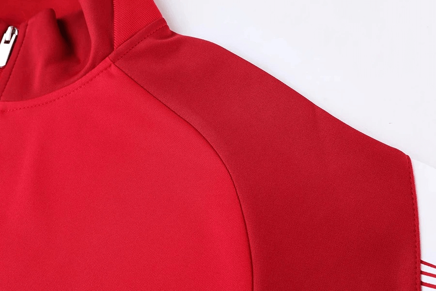 Close-up of red full zipper cycling jersey with reflective stripes, showing windproof polyester fabric and hooded collar detail.