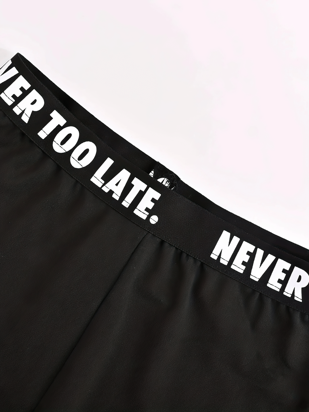 Close-up of Girls Black Leggings and Stretch Waistband - SF3677 with "Never Too Late" motivational print.