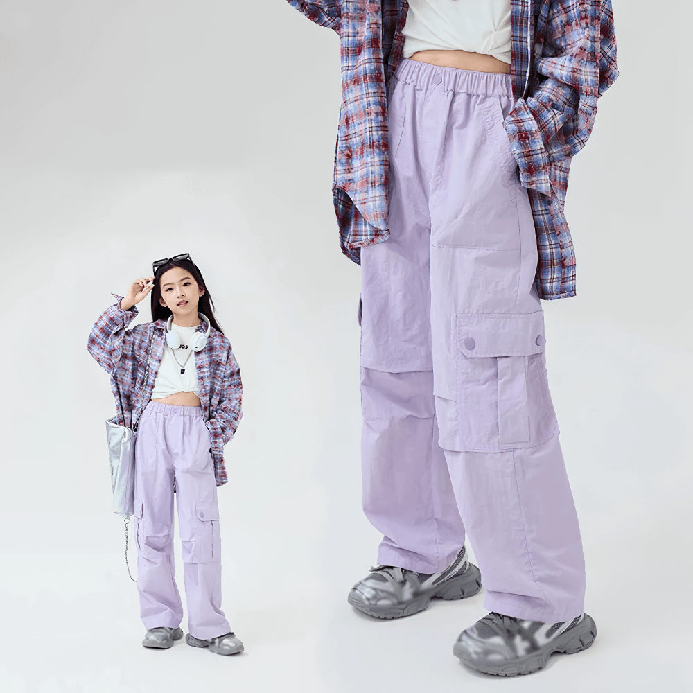 Girl wearing stylish Girls Cargo Pants with Pockets and Elastic Waist - SF3672, paired with a plaid shirt and sneakers for casual outdoor fun.