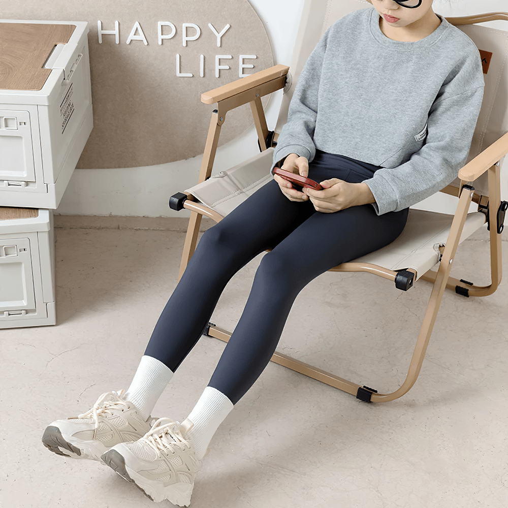 Teen wearing Girls Elastic Stretch Ankle Leggings for Fitness - SF3756, sitting casually for active lifestyle showcase.