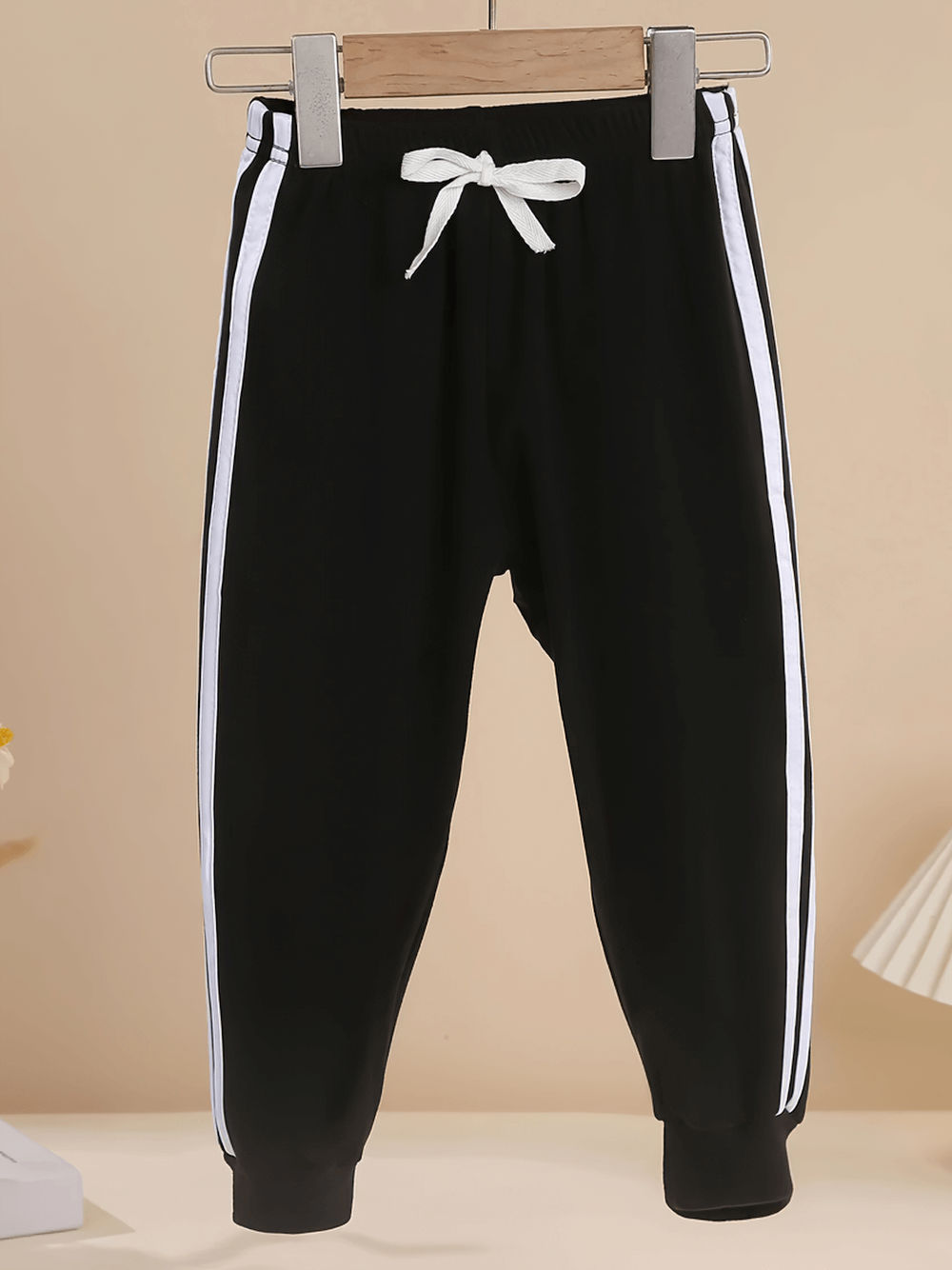 Girls Elastic Waist Joggers with Side Sporty Stripes - SF3860, black pants with white stripes, display on hanger.