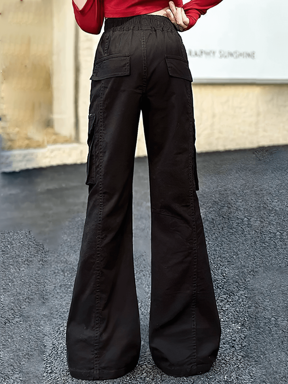 Back view of black Girls Flare Pants with High Waist and Pockets - SF3726 showcasing cargo style and flap pockets.