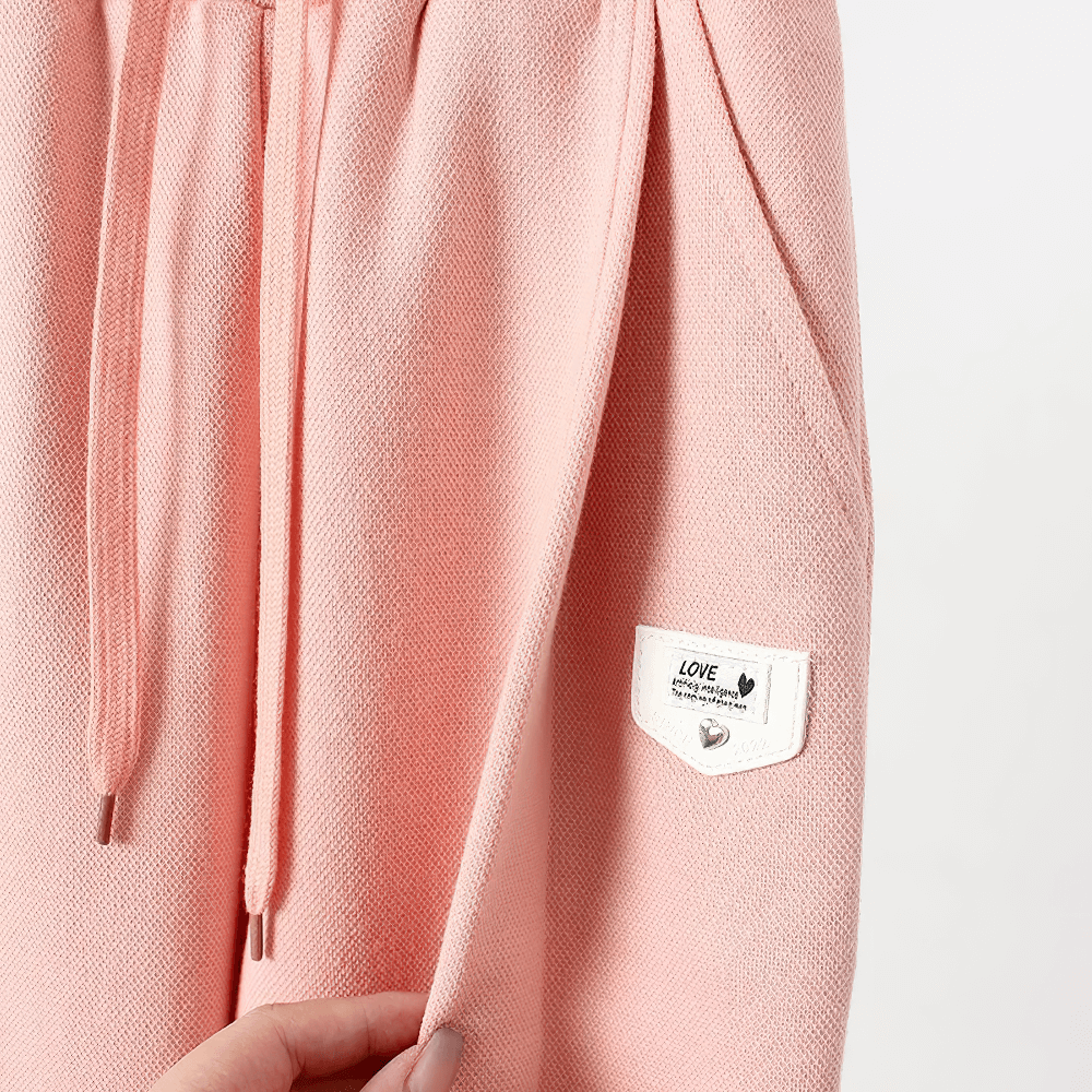 Close-up of Girls High-Waist Cotton Jogger Pants with Pockets - SF3658 in pink, highlighting drawstring and pocket details.