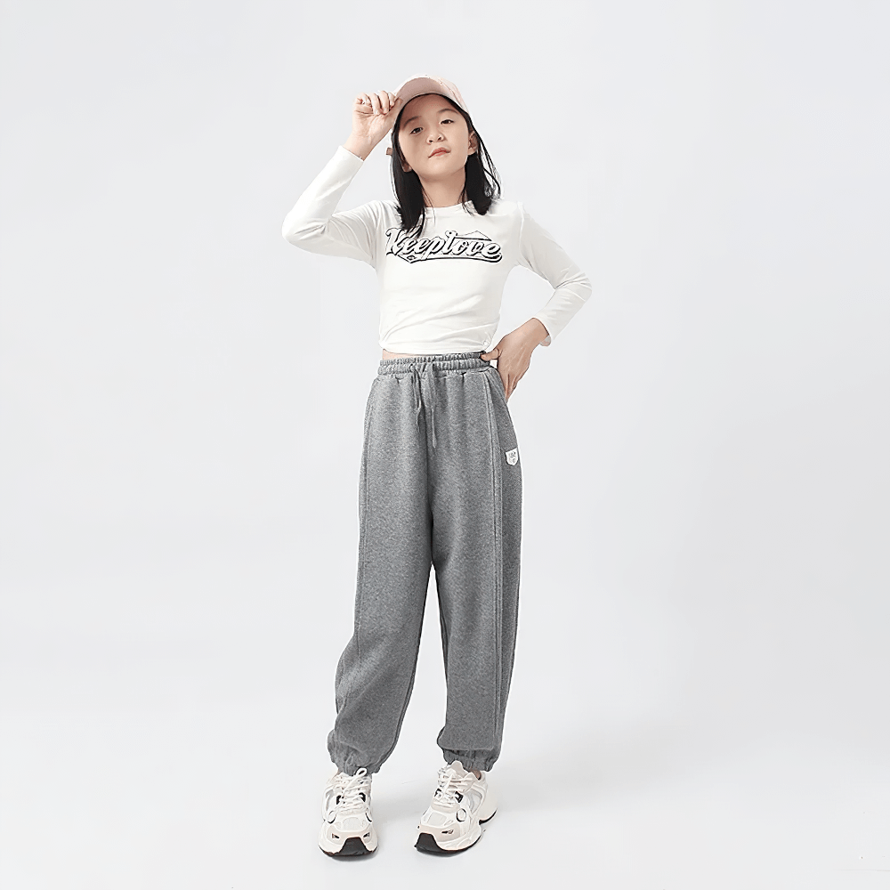 Girl wearing Girls High-Waist Cotton Jogger Pants with Pockets - SF3658; stylish, breathable, perfect for casual or sportswear.