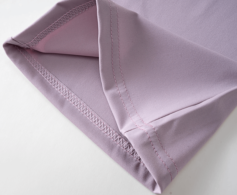 Close-up of the hem of Girls High Waist Flared Leggings for Training - SF3817 in lavender color, showing stitching detail.