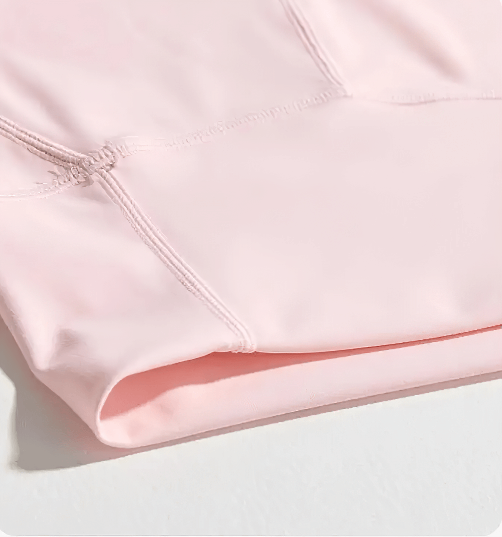 Close-up view of Girls High-Waisted Sport Shorts for Yoga and Running - SF3838 in soft pink, showcasing anti-sweat nylon fabric and seam details.