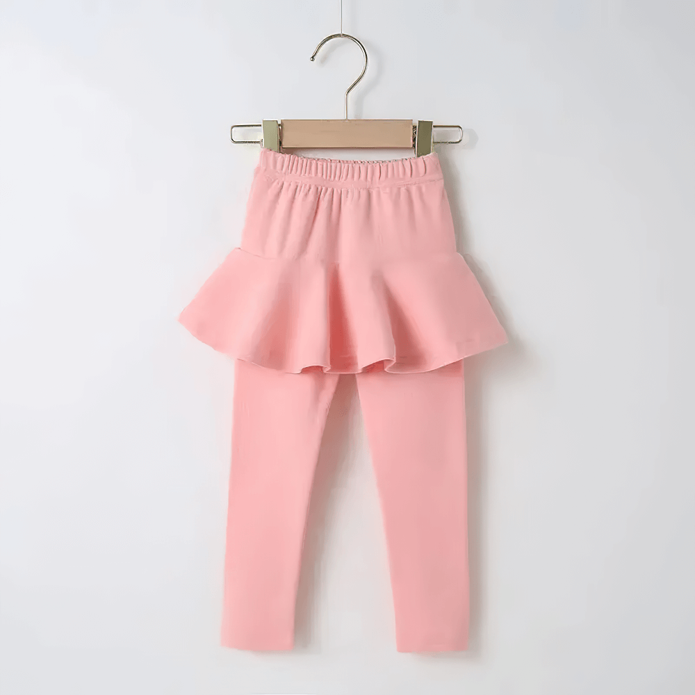 Girls Layered Sport Stretch Leggings with Skirt SF3855 in pink on hanger - athletic flared design perfect for dance or play.