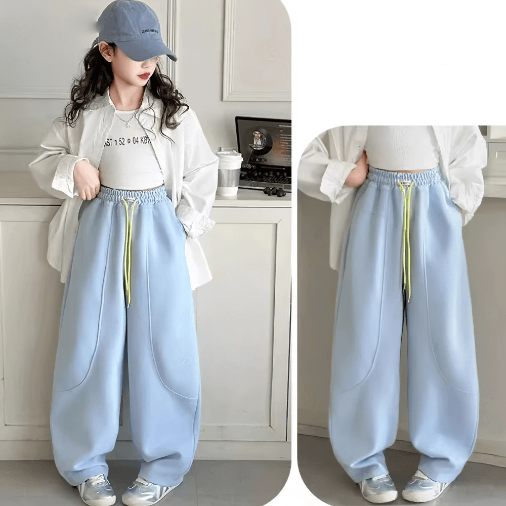 Girls Loose Fit Sporty Pants with Drawstring Waist - SF3709, windproof trousers for active kids in blue, showcased by a young girl model.