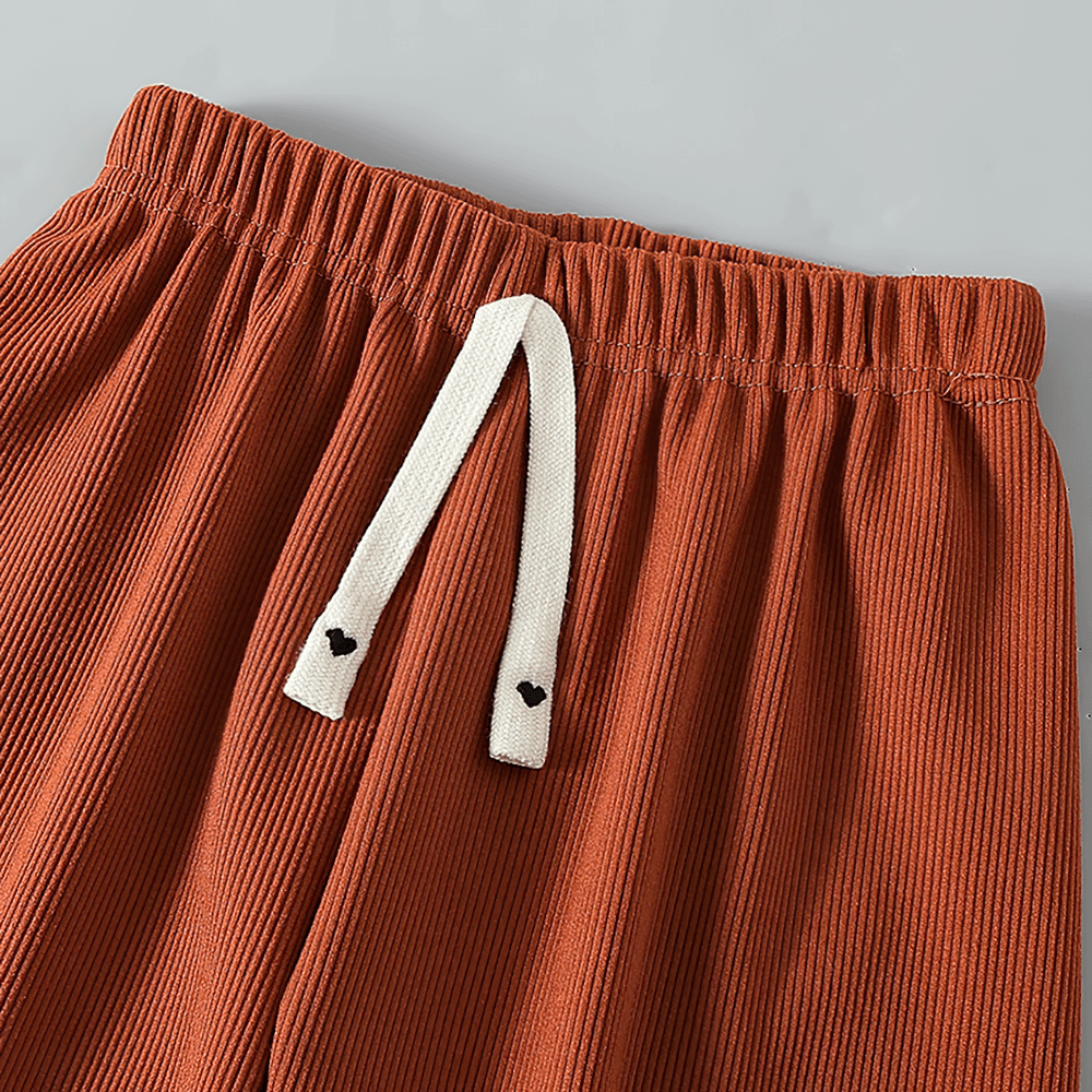 Close-up of brown elastic waist jogger pants with bow detail, Girls Plush Lined Sport Jogger Pants With Bow - SF3875.
