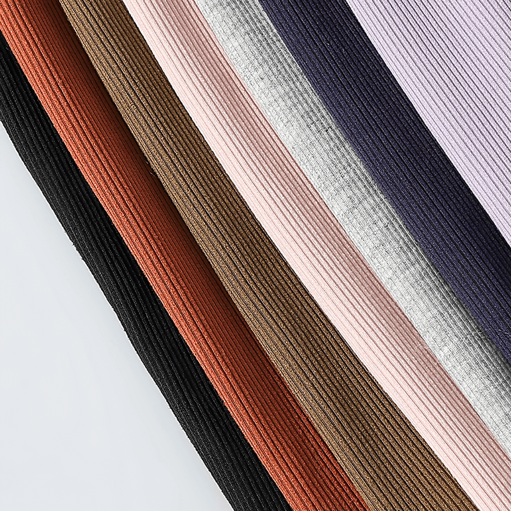 Colored ribbed fabric swatches showcasing the variety of texture and hues, perfect for versatile fashion and upholstery projects.