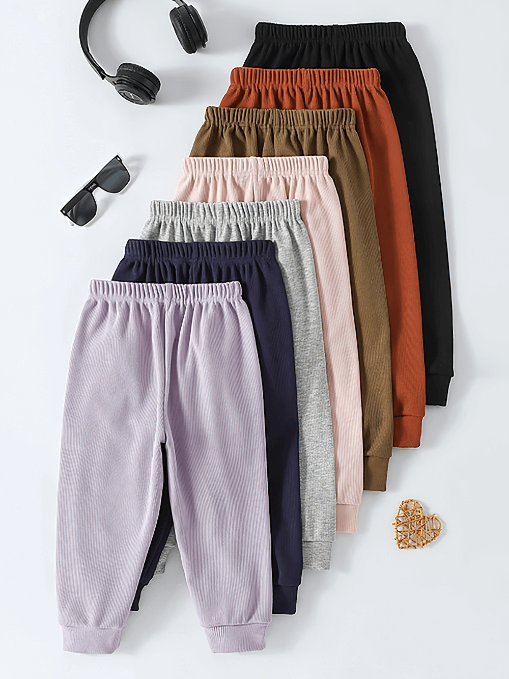 Colorful lineup of Girls Plush Lined Sport Jogger Pants With Bow - SF3875 showcasing variety and style with cute accessories.