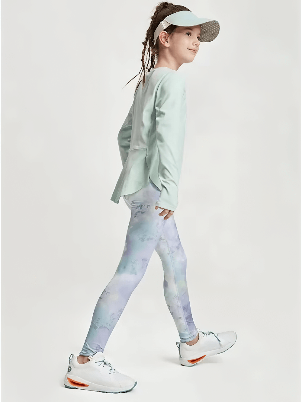 Young girl wearing Girls Quick Dry Long-Sleeved Sports Top for Yoga - SF3859 in green, paired with colorful leggings and sporty shoes.