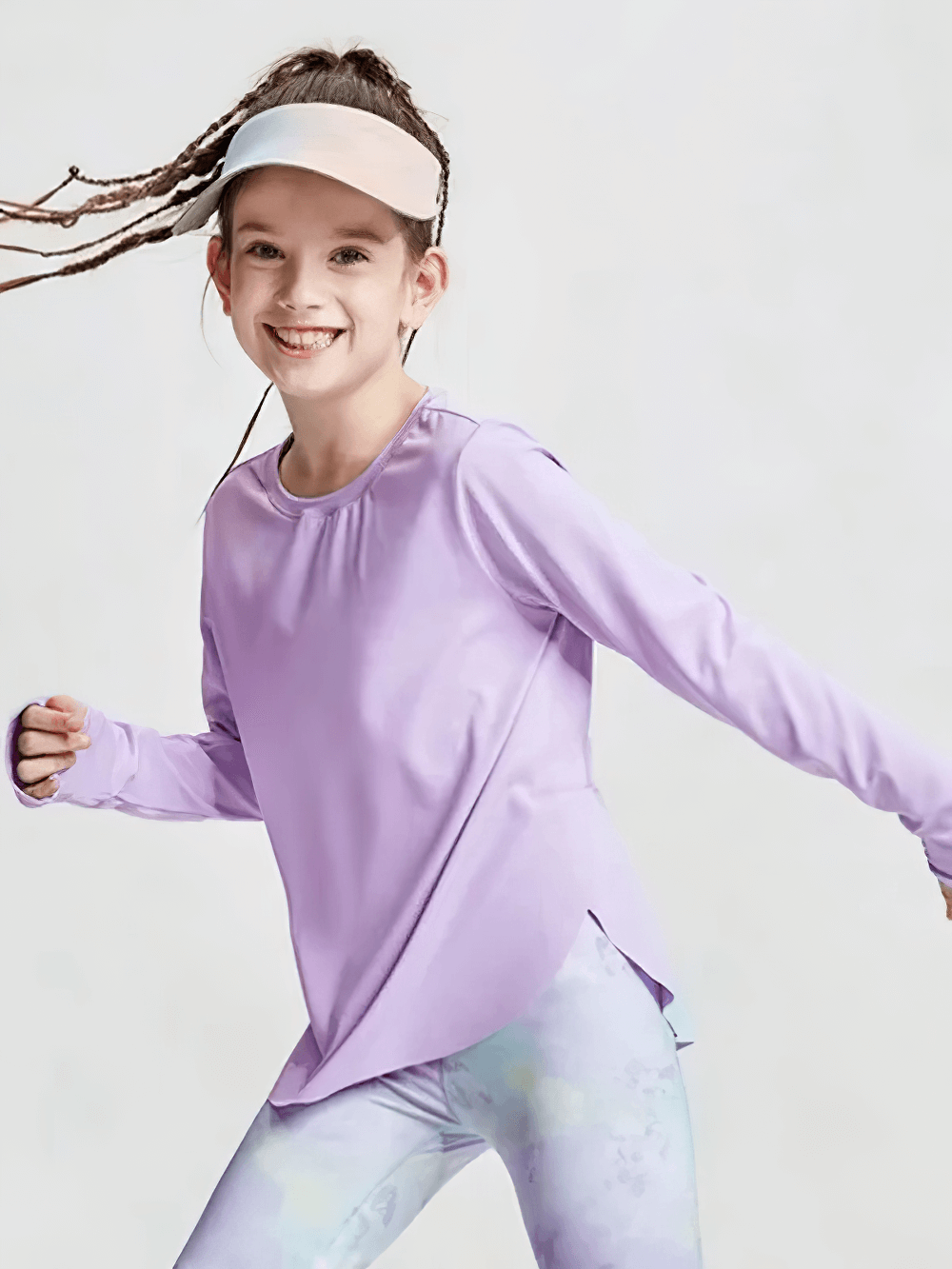 Girl wearing purple Girls Quick Dry Long-Sleeved Sports Top for Yoga - SF3859, running joyfully in a studio setting.