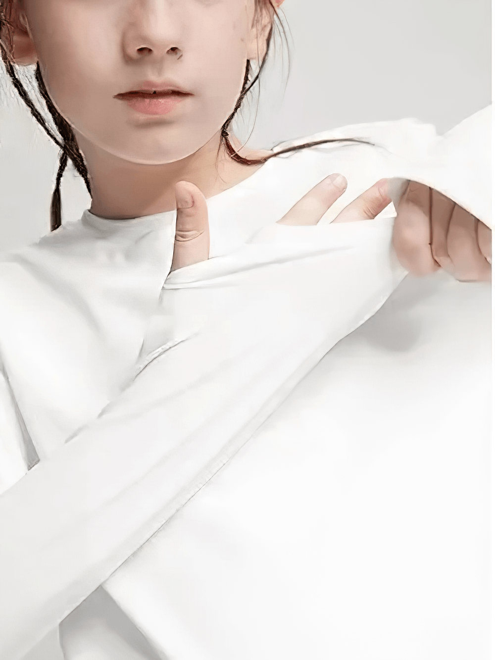 Girl wearing a Girls Quick Dry Long-Sleeved Sports Top for Yoga - SF3859 with crossed hem design, perfect for active activities.