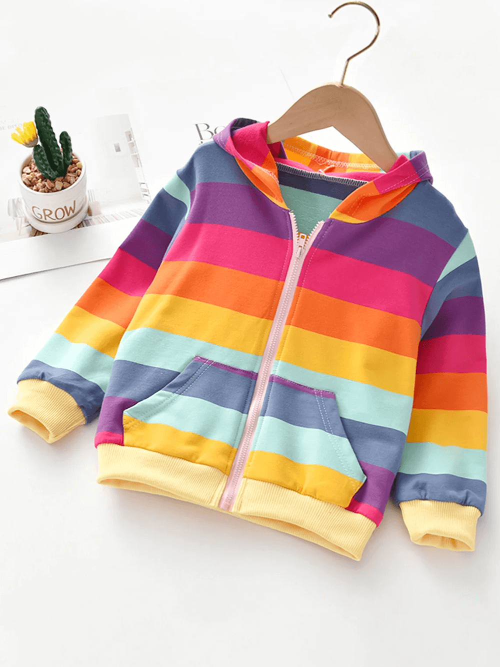 Cheerful Girls Rainbow Stripe Zip Hoodie with Pockets - SF3598 hanging on a hanger showcasing its vibrant colors and full zipper design.
