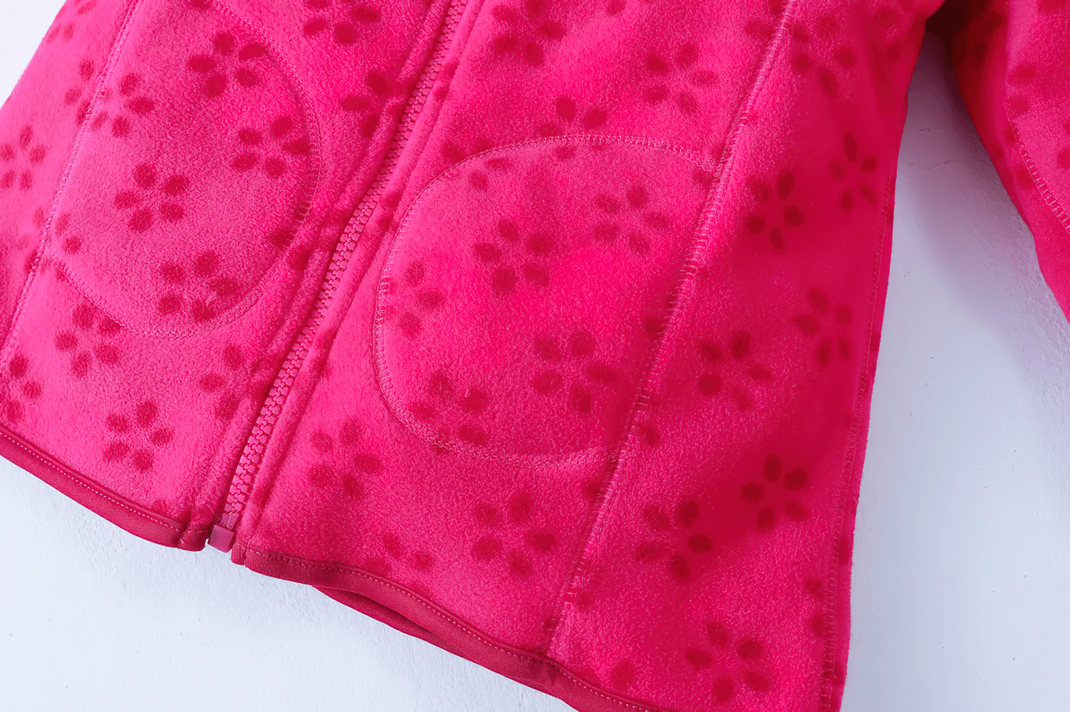 Girls Rose Red Fleece Zip Jacket with Pockets - SF3530 featuring soft floral pattern and round front pockets for cozy kids' outerwear.