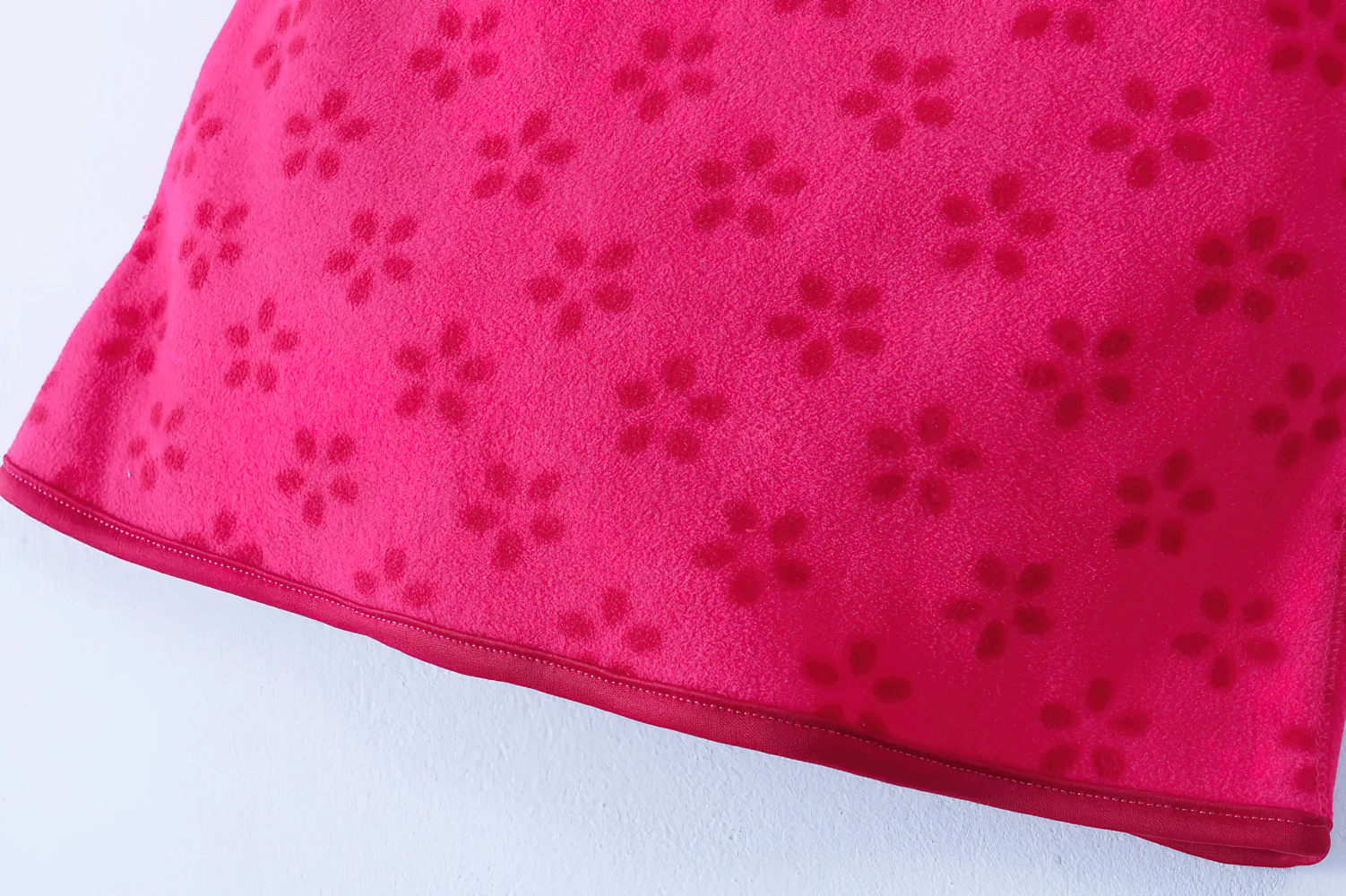 Close-up of Girls Rose Red Fleece Zip Jacket with Pockets - SF3530 showing floral pattern.