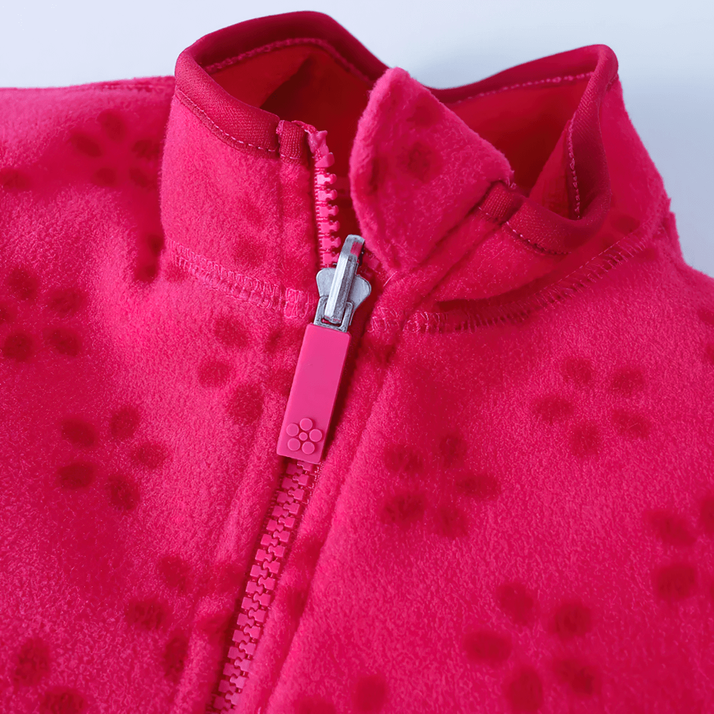 Close-up of Girls Rose Red Fleece Zip Jacket with Pockets - SF3530, showing smooth zipper and soft printed fleece detail.