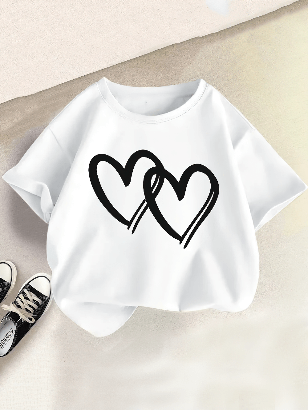 Girls' Round Neck T-Shirt with Heart Printed - SF3863 displayed on table