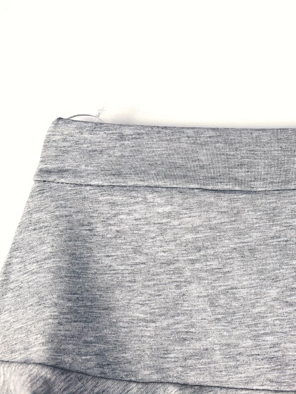 Close-up of Girls Skirted Stretch Shorts for Active Play Kids - SF3857 showing soft grey fabric and elastic waistband.
