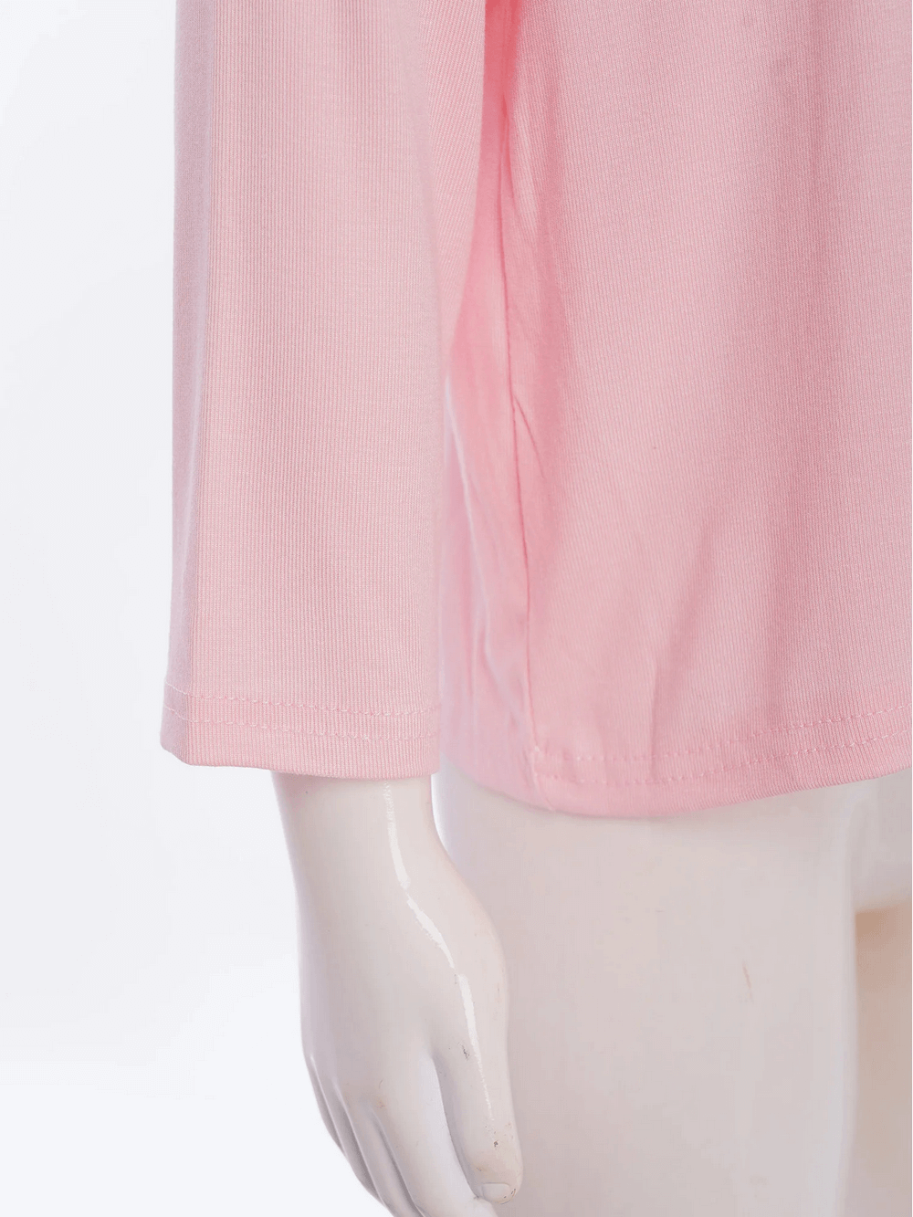 Close-up of pink Girls Solid Color Button Up Long-Sleeved Top - SF3979 with mannequin hand showcasing soft cotton fabric.