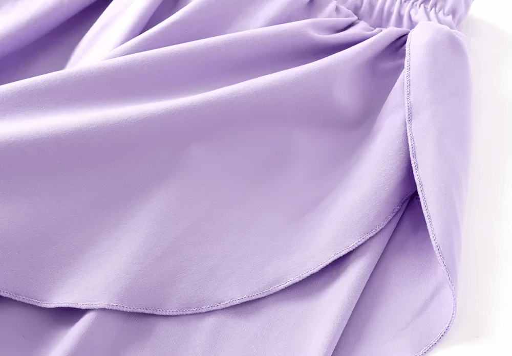 Close-up of the flow skirt design on Girls Sports Leggings with Flow Skirt Design - SF3673 in lavender color