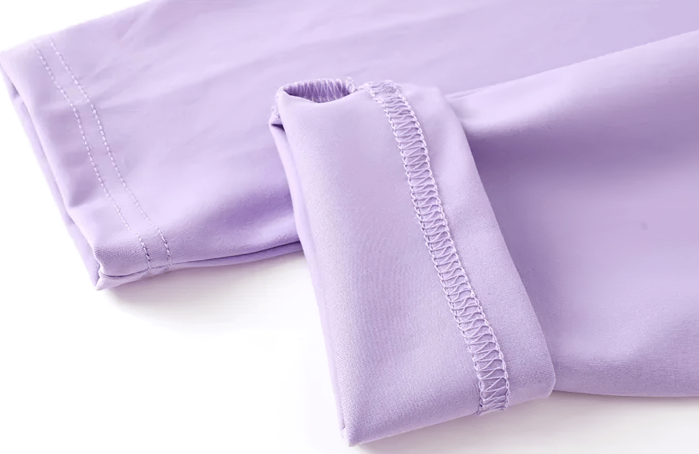 Close-up of purple fabric details of Girls Sports Leggings with Flow Skirt Design - SF3673, highlighting quality stitching and material.
