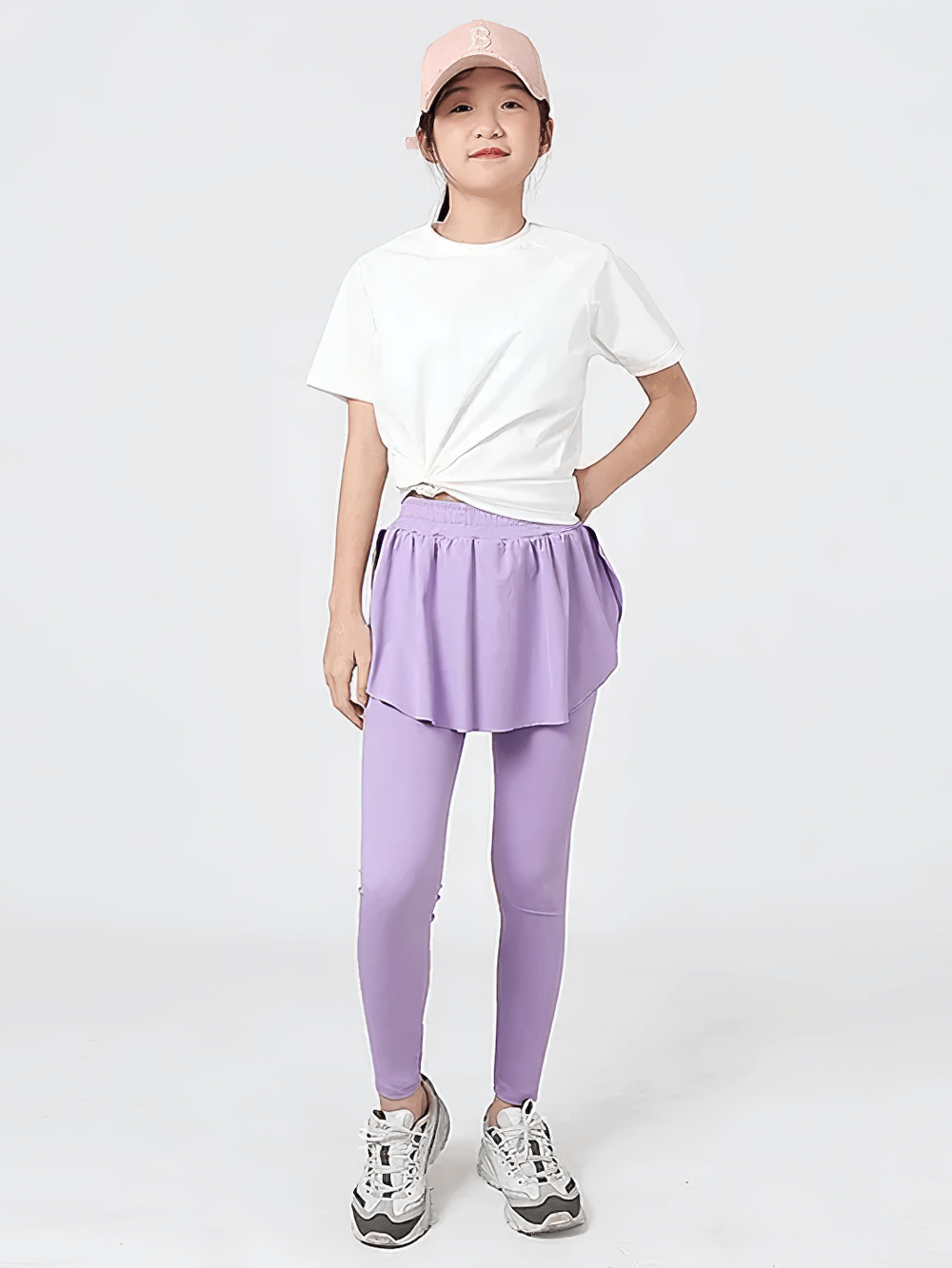 Girl wearing Girls Sports Leggings with Flow Skirt Design - SF3673, high-waist, ideal for running or dance.