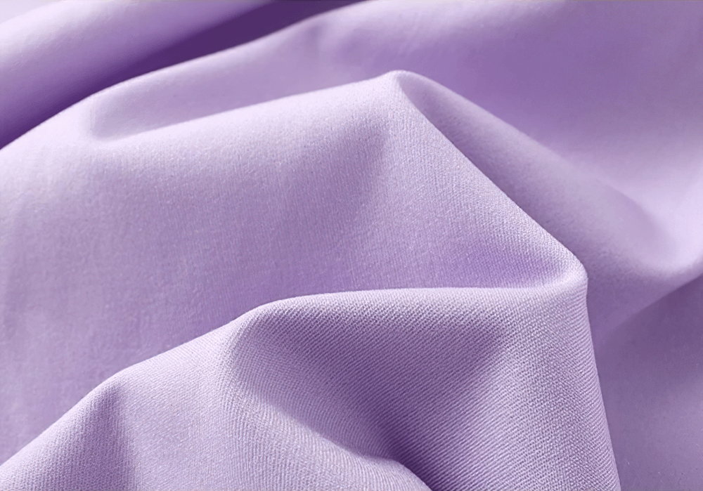 Close-up of lavender fabric texture showcasing smooth and soft material ideal for Girls Sports Leggings with Flow Skirt Design - SF3673.