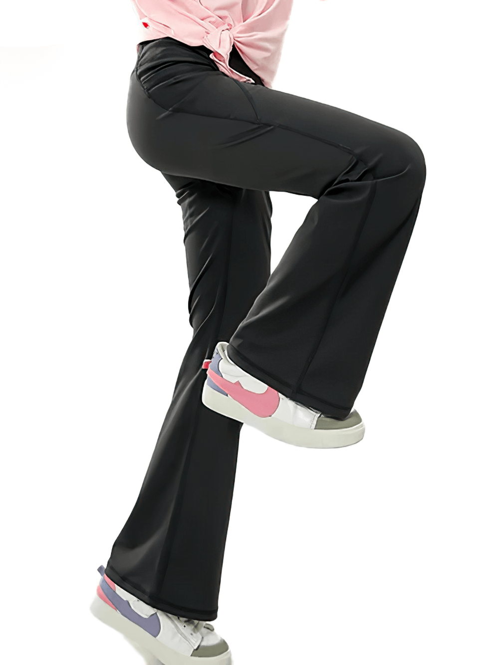 Girl wearing black Girls Stretch Flared Pants with Breathable Fabric - SF3610, demonstrating flexibility and side pocket detail.