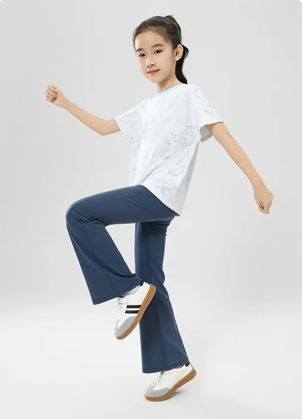 Girl wearing Girls Stretch Flared Pants with Breathable Fabric - SF3610, demonstrating flexibility and style in navy flared pants.