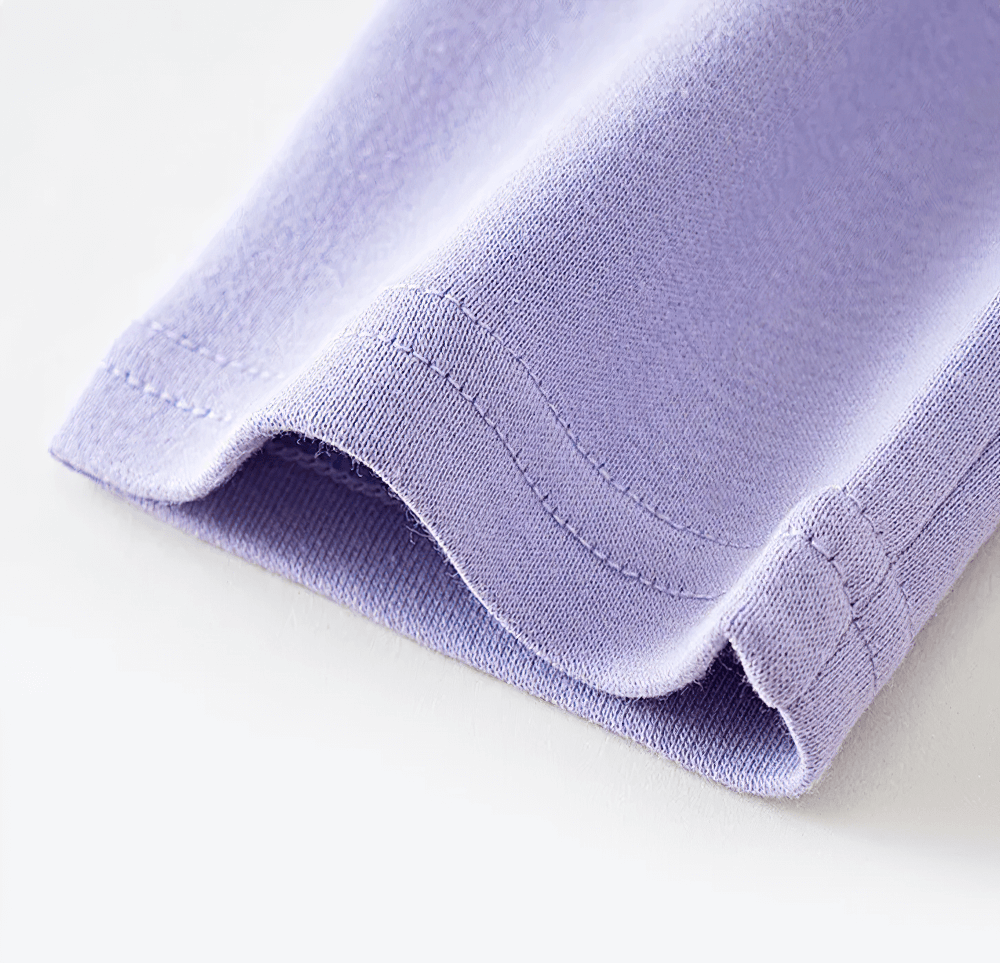 Close-up of purple fabric from Girls Stretchy Sport Leggings in Soft Solid Colors - SF3681, showcasing the soft stitch detail.