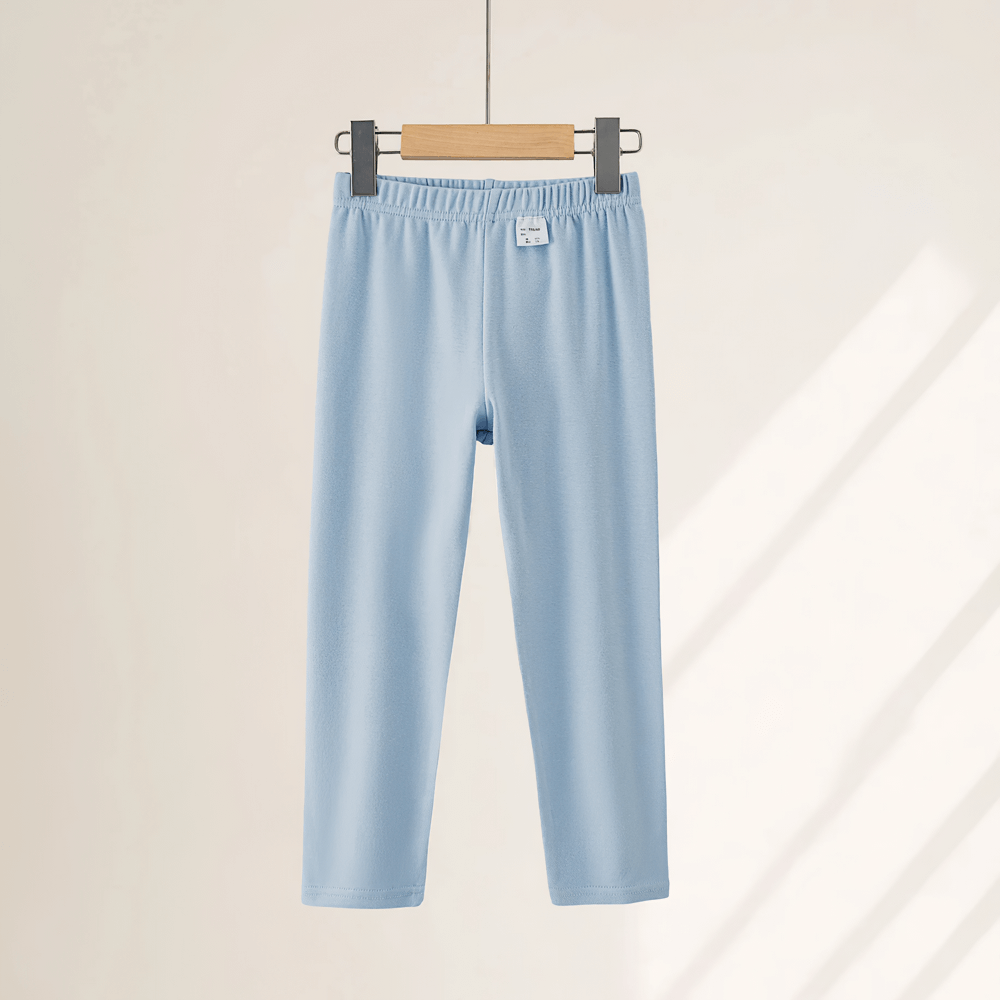 Girls Stretchy Sport Leggings in Soft Solid Colors - SF3681 hanging on hanger, showcasing lightweight stretch fabric for kids.