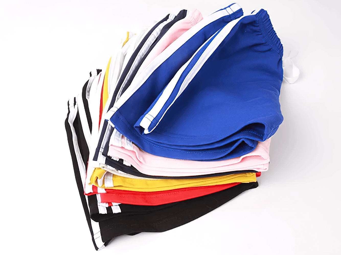 Athletic Drawstring Shorts With Side Sport Stripes - SF3727 in various colors stacked neatly showcasing breathable fabric.