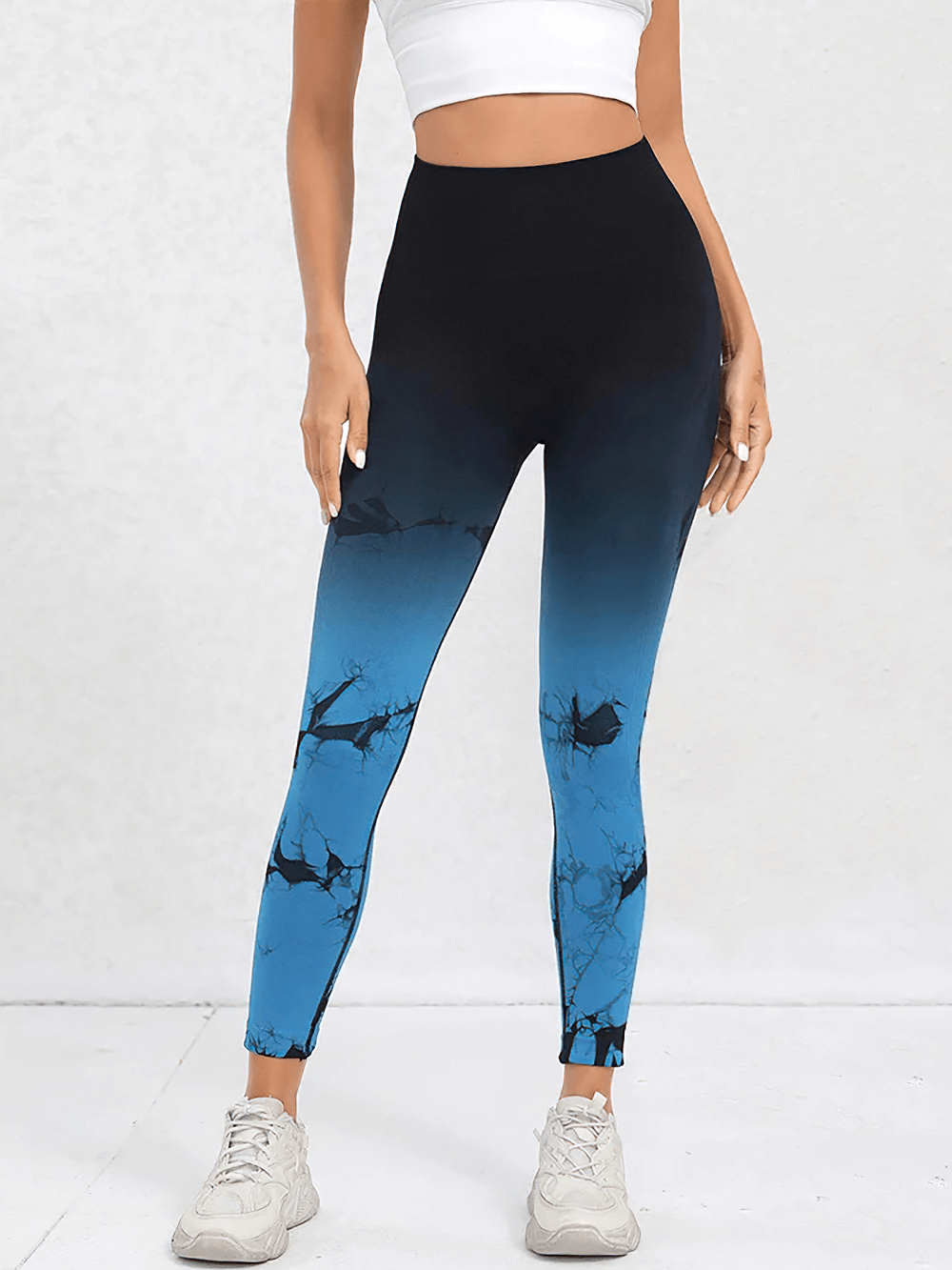 Woman wearing Gradient High Waist Seamless Sports Leggings - SF4068 in blue ombre with a white crop top