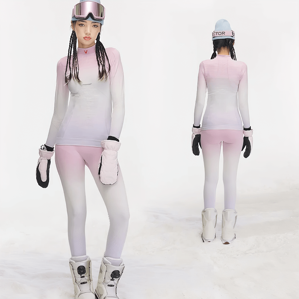 Woman wearing Gradient Thermal Base Layer Set for skiing, featuring long-sleeve top and leggings, perfect for outdoor activities and warmth.