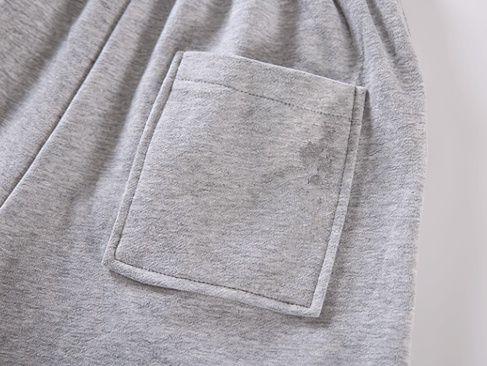 Close-up of side pocket on Graphic Drawstring Knee-Length Sports Shorts - SF3771 in light gray fabric, highlighting practical design.
