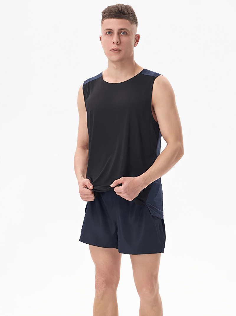 Man wearing Gym Breathable Double Color Tank Top for Men - SF1813, in black and navy color, perfect for workouts.