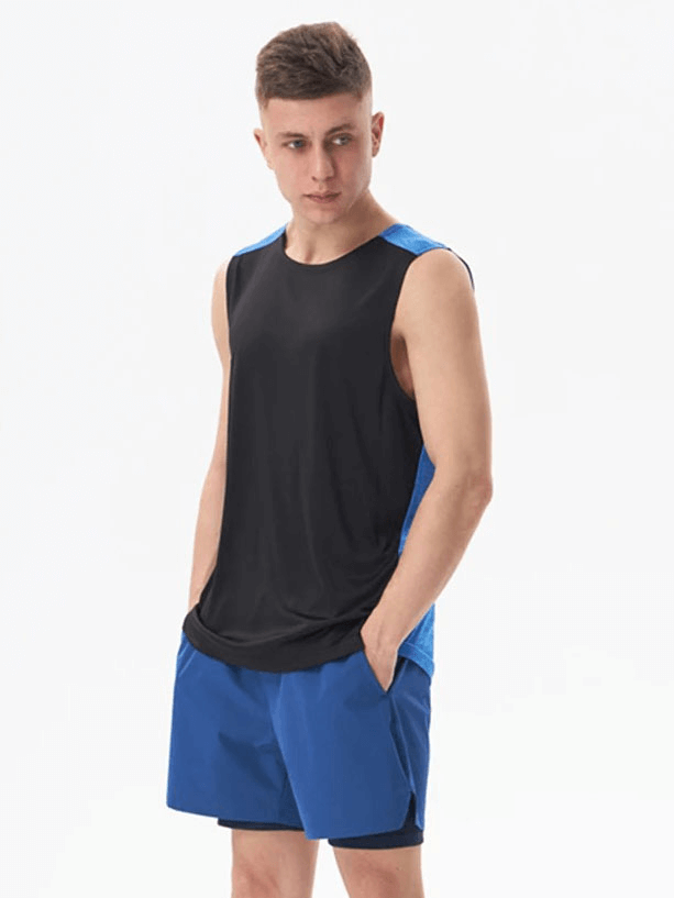 Male model wearing Gym Breathable Double Color Tank Top SF1813 in black and blue, perfect for workouts, made from broadcloth polyester.