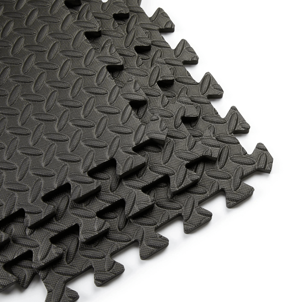 Interlocking black EVA foam gym floor mats, 30x30cm, ideal for home gyms and workout areas, durable and water-resistant design.