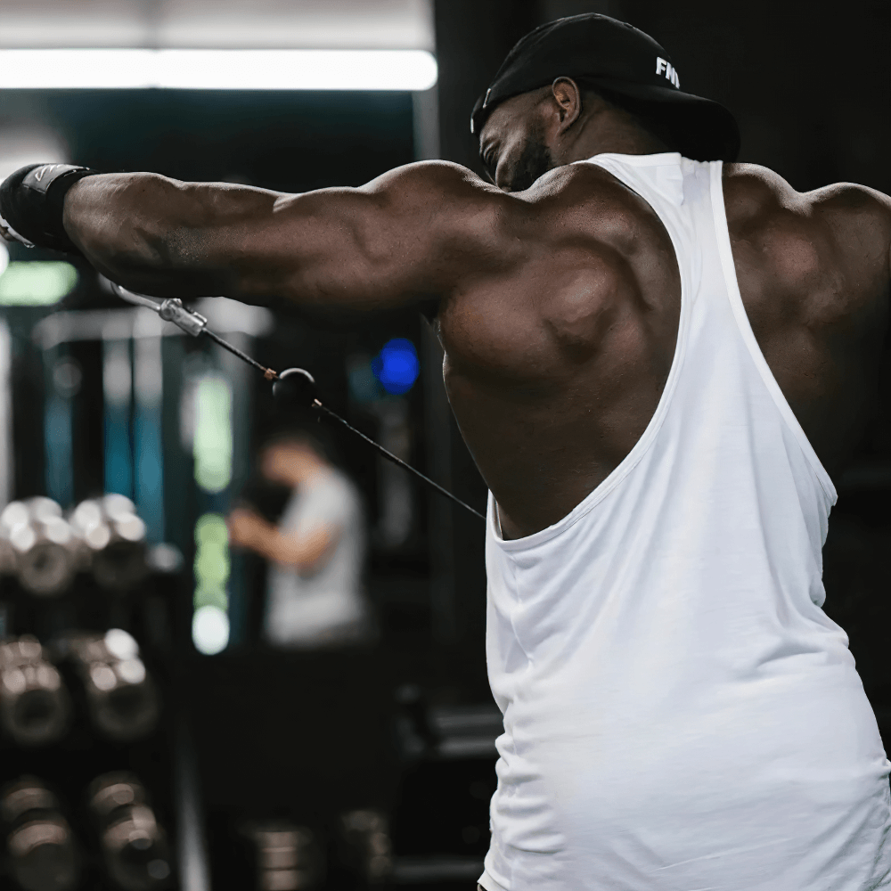 Gym Tank Top with Bold Barbell Logo for Training - SF4095 worn by a man lifting weights at the gym