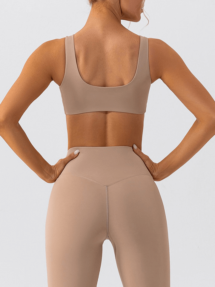 Back view of woman wearing tan seamless sports bra and leggings for yoga and workouts, showcasing comfortable and breathable fit - SF1314
