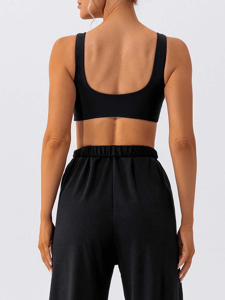 Back view of a female athlete wearing a black Gym Workout Breathable Seamless Sports Bra with soft underwear, focusing on comfort and support.