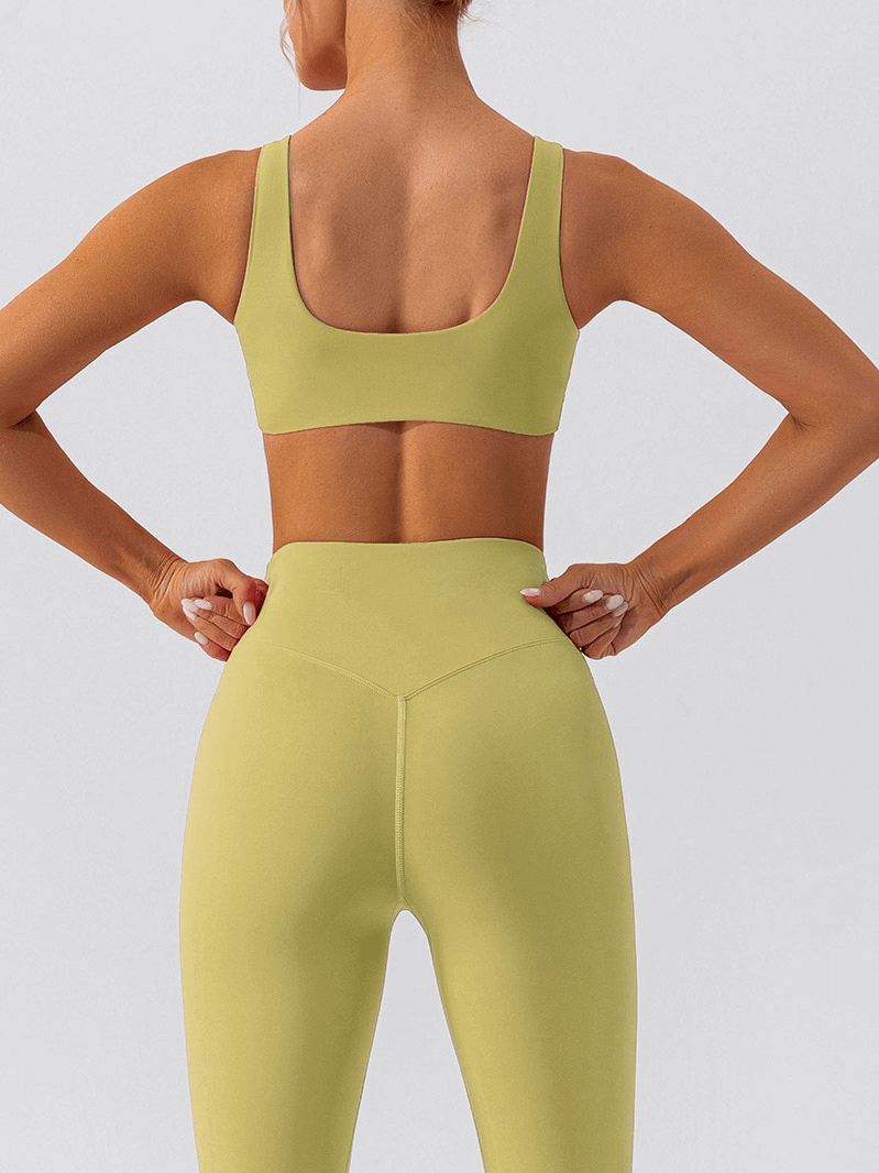 Back view of model wearing a breathable seamless sports bra for gym workouts, showcasing stylish and comfortable athletic apparel.