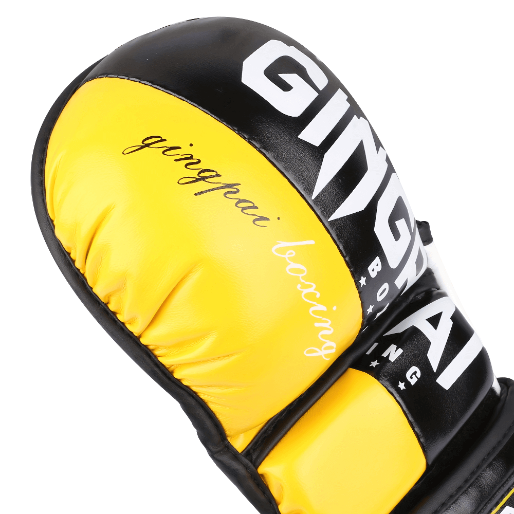 Close-up of yellow and black half-finger boxing glove with branding, designed for breathability and wrist support during training.