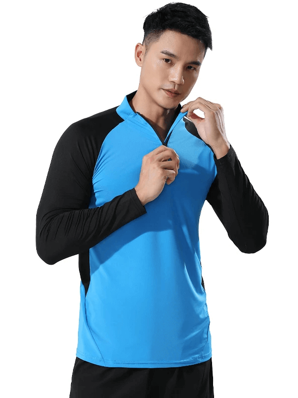 Man wearing blue and black half-zip athletic fit training top for performance and style